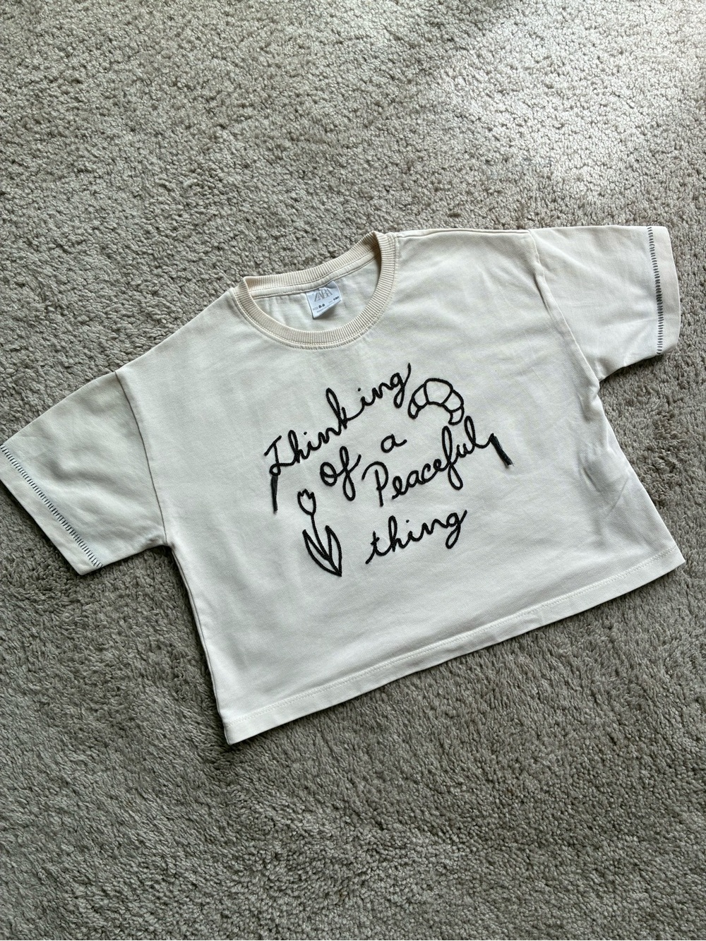 Zara Cream Short Sleeve Tee with Embroidered Black Script Graphic